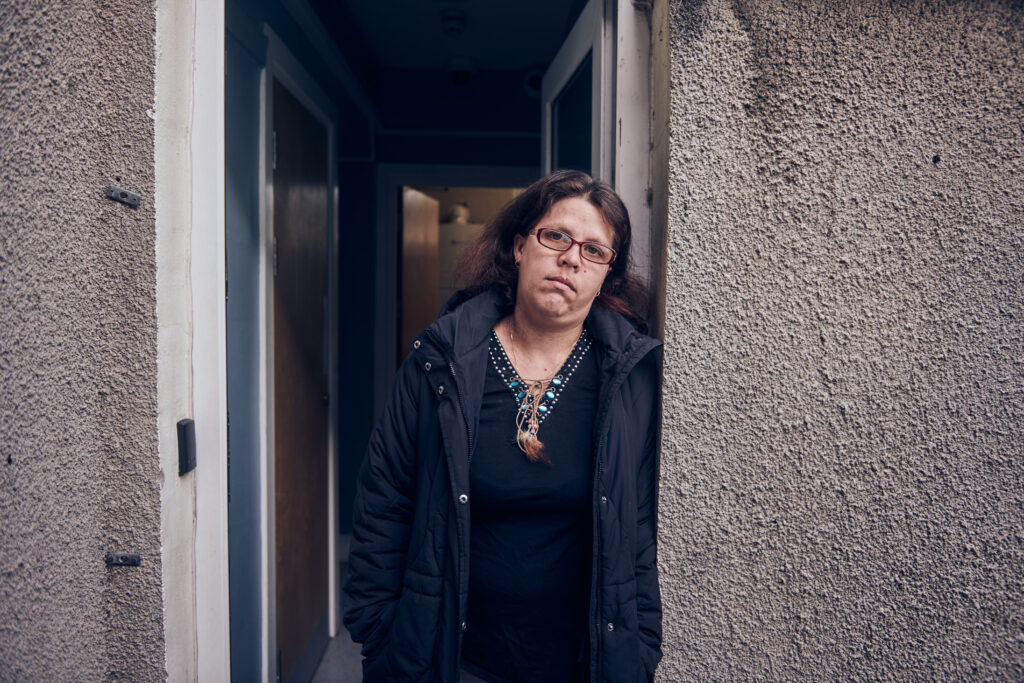 Female service user stood in doorway of homeless project in Bridgend