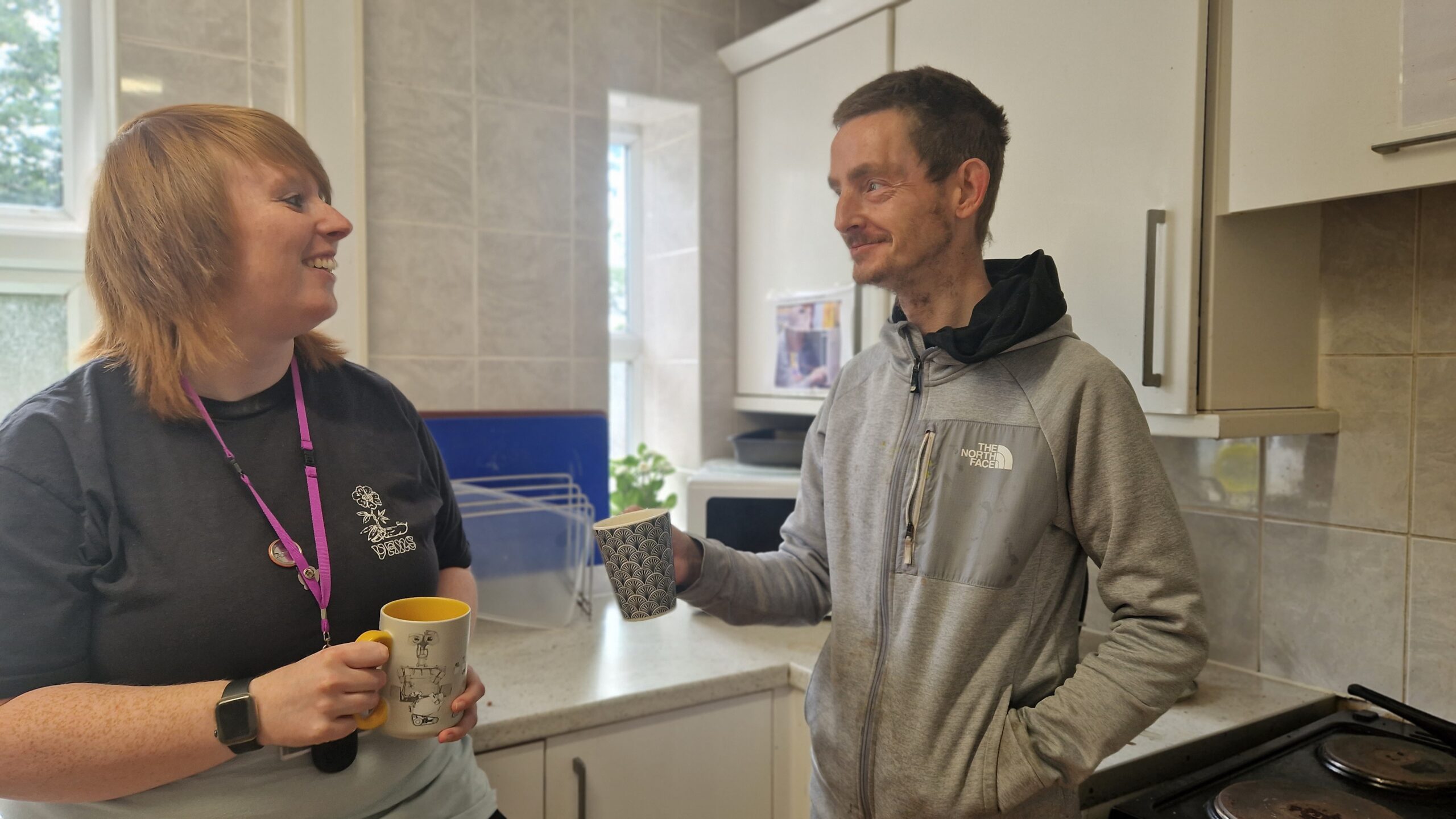 The Wallich conflict resolution worker with client sharing a cup of tea in Wrexham - The Wallich homeless