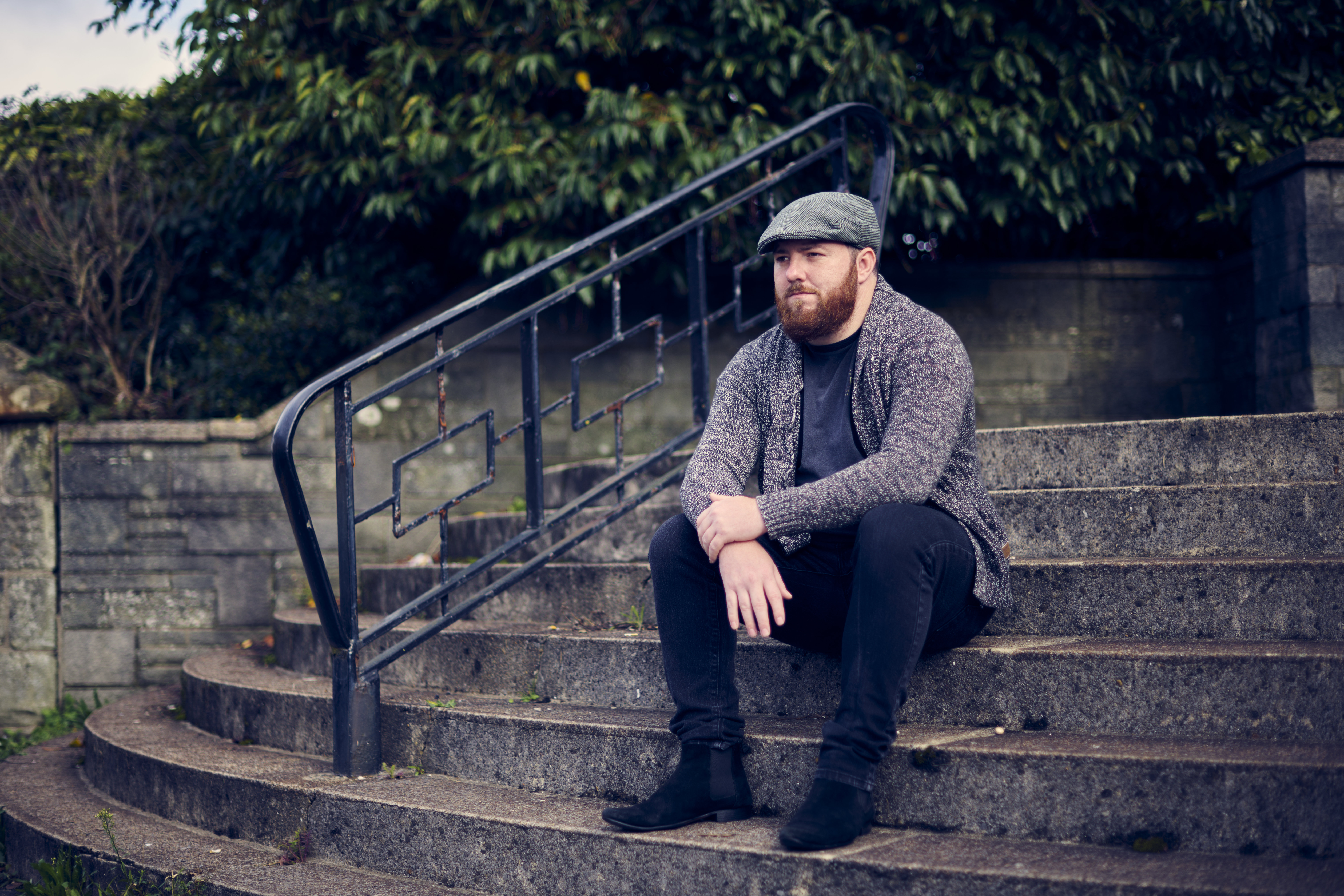 Service user sitting on steps