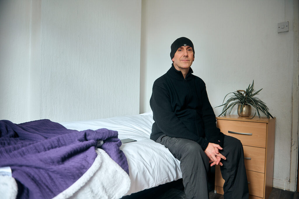Service user sitting in bed